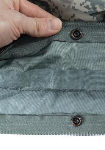  US Gore-Tex Bivy Bag, UCP, Surplus. The bivy has snap fasteners on both sides of the zipper on the inside for attaching it to the US sleeping bag. It also works very well unbuttoned with other sleeping bags.